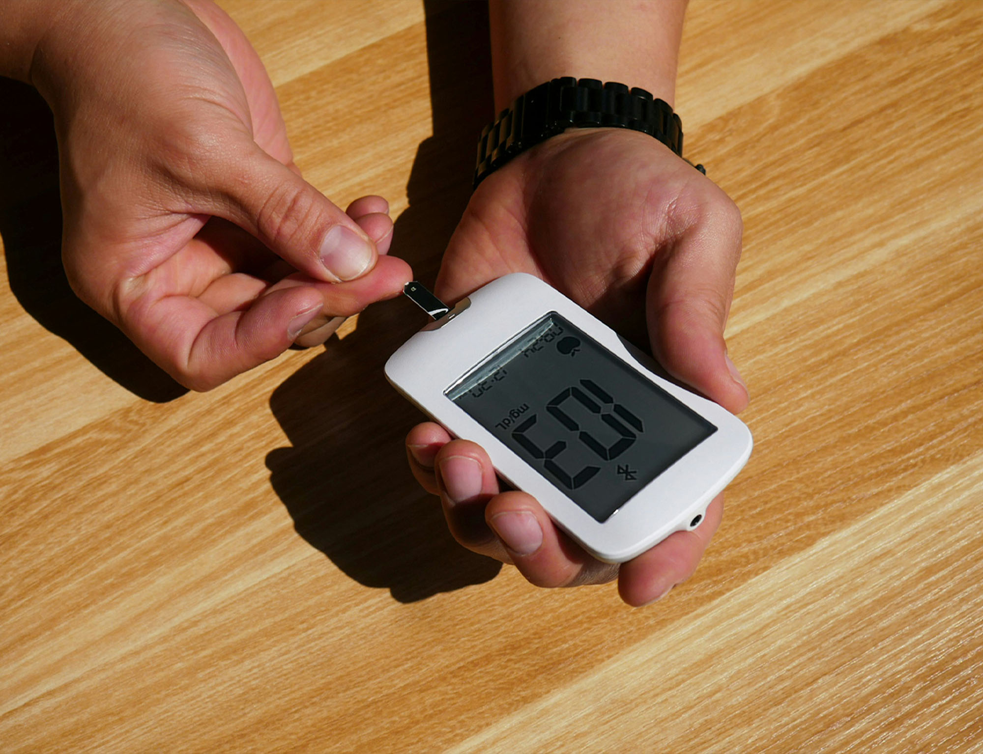 person checking their blood sugar levels