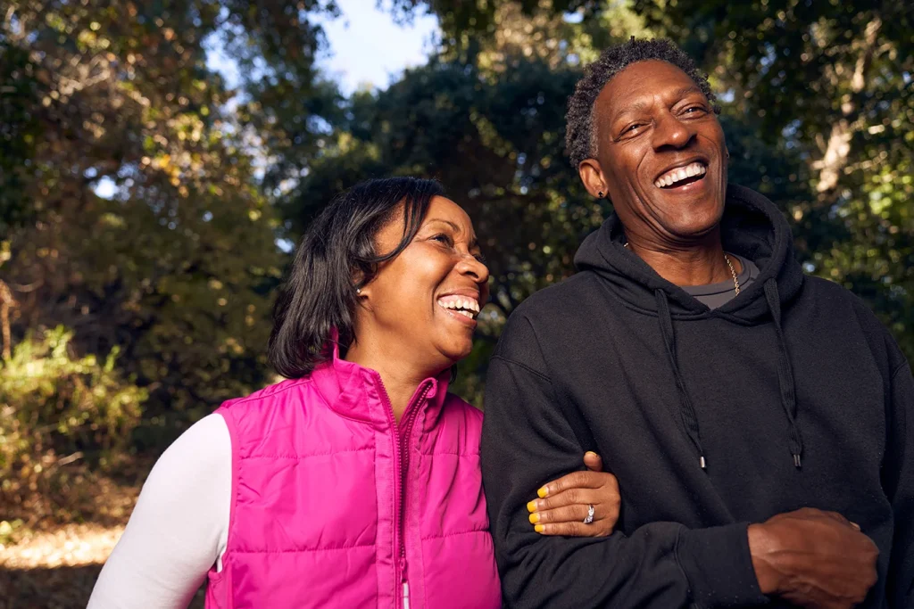 Adult Senior Black Couple Walking on Hiking Trail in Nature
