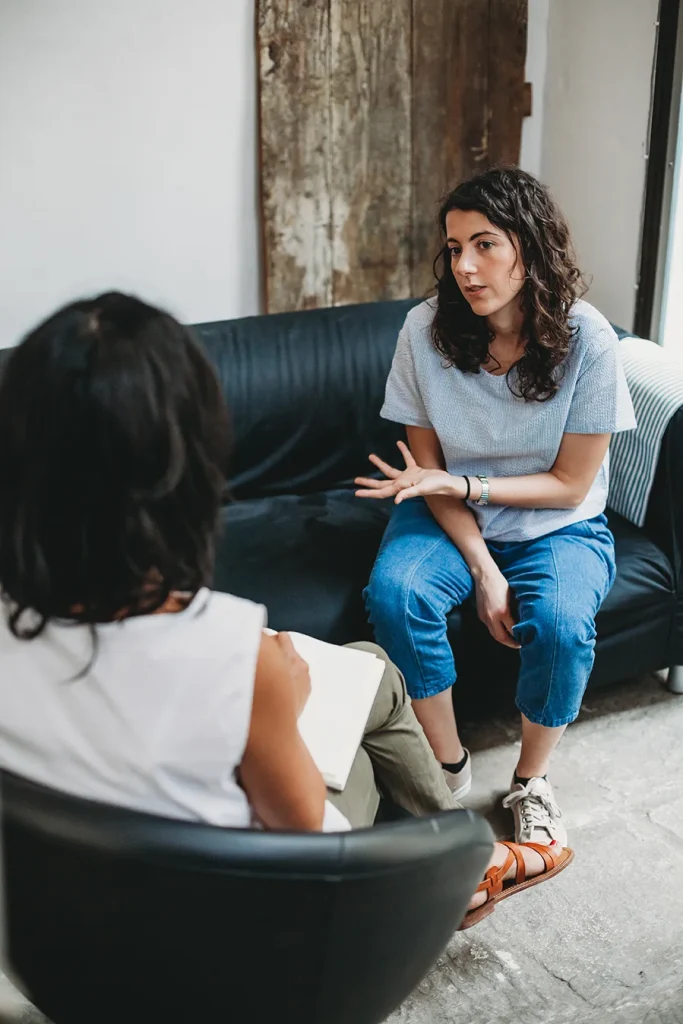 Psychotherapy session, woman talking to their psychologist in the studio