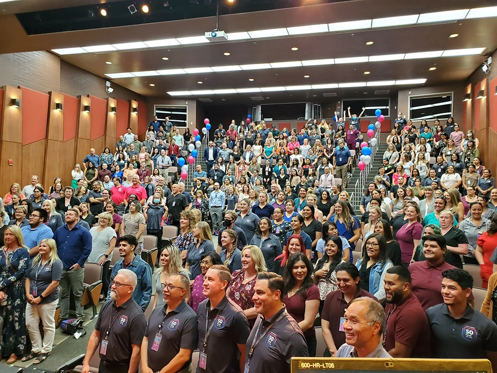 Gathering of CVCH employees in an auditorium